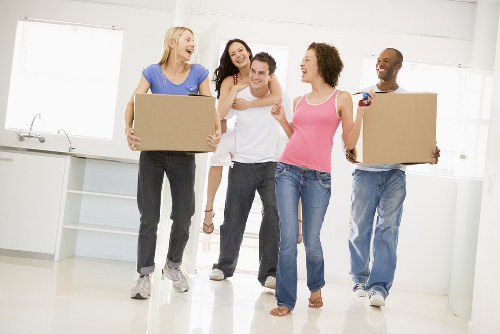 Furniture pick-up team removing bulky household items in Acton
