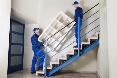 Local house removals service in Acton with moving team and packed boxes