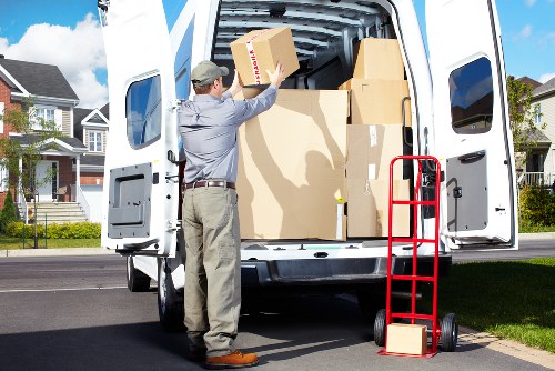 Boxes and furniture being loaded into a removals van
