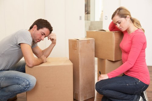 Loading furniture into a moving truck in Acton