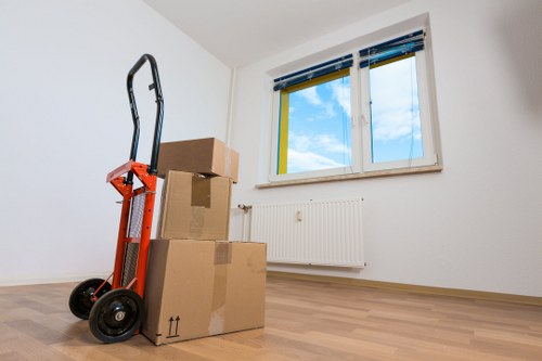 Commercial office items being transported by removals van in Acton