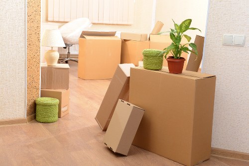 Packed boxes and furniture prepared for removals in Acton