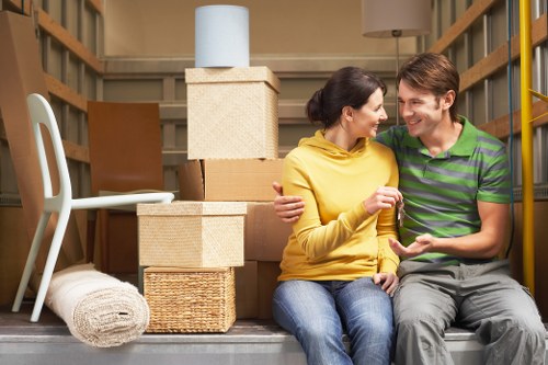 Packed moving boxes and furniture for an Acton move